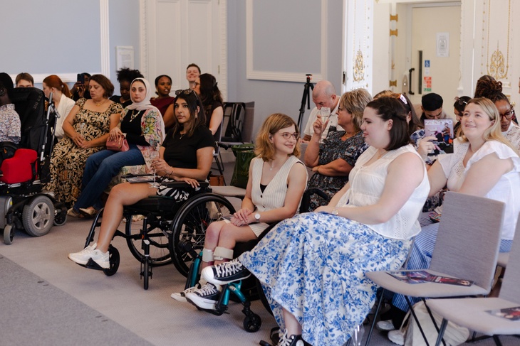 Guests watching the fashion show