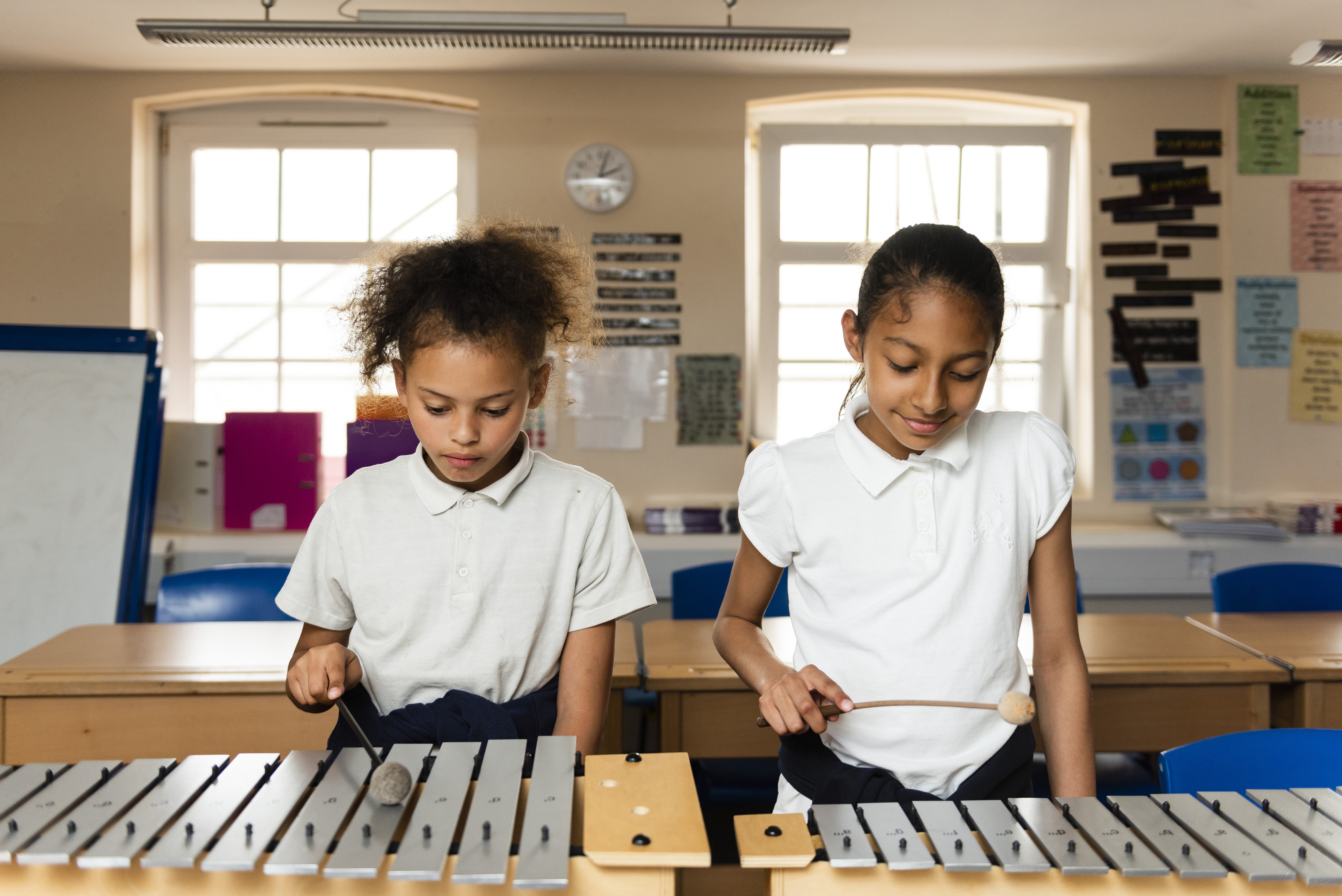Randal Cremer_two children playing with xylophone