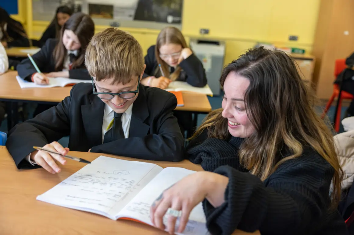 Photo of a literacy teacher with a pupil