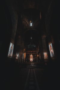 Mother and son alone in a corner of the church
