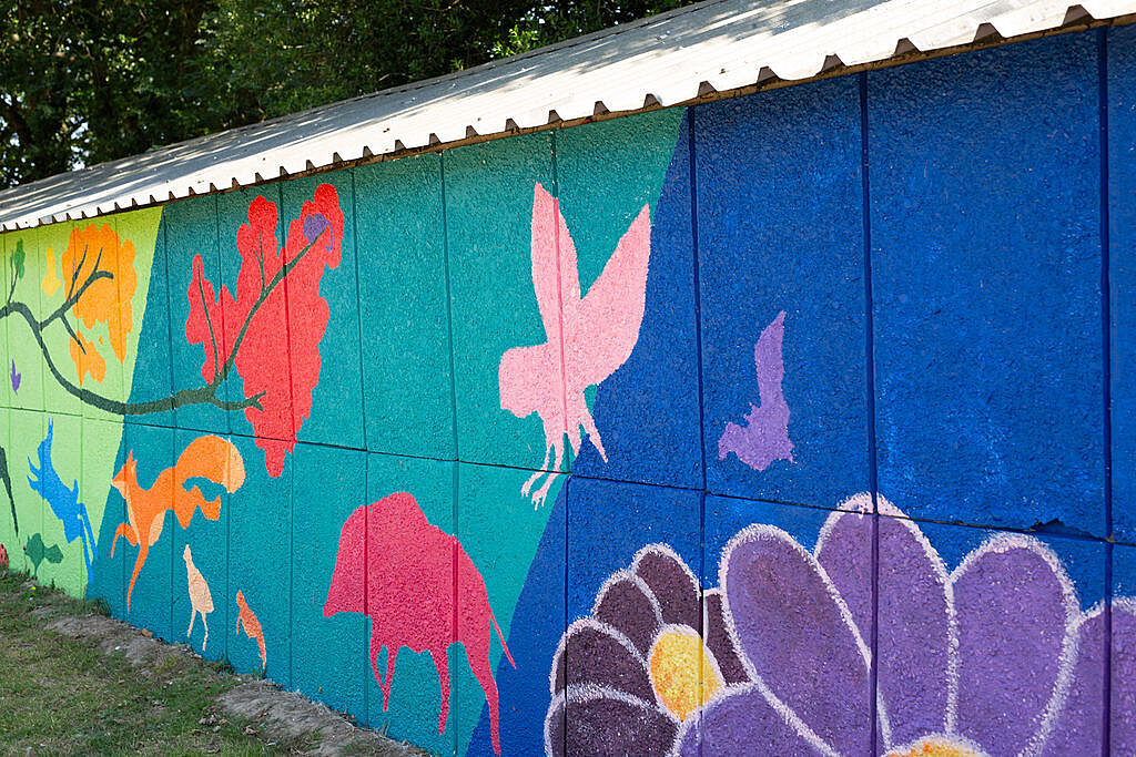 Close up off the mural showing trees, flowers and woodland animals.