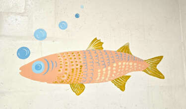 A pastel orange and yellow fish with blue bubbles painted onto a white painted brick wall