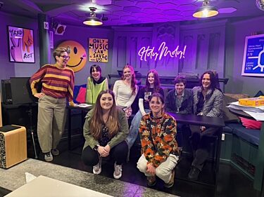 five youth board members and three artswork staff smile at their youth board away day