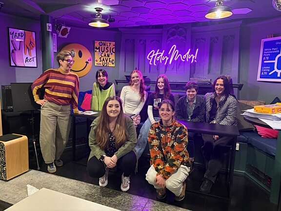 five youth board members and three artswork staff smile at their youth board away day