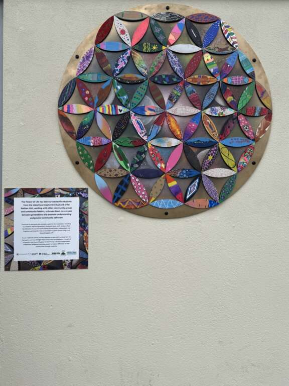 flower of life geometric artwork hung on wall made from many individually decorated petals