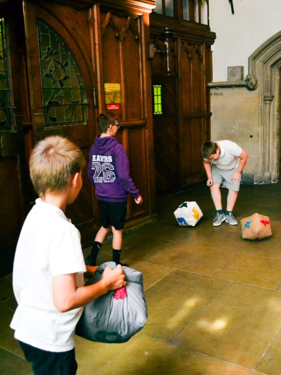 two young people playing with the craft ball