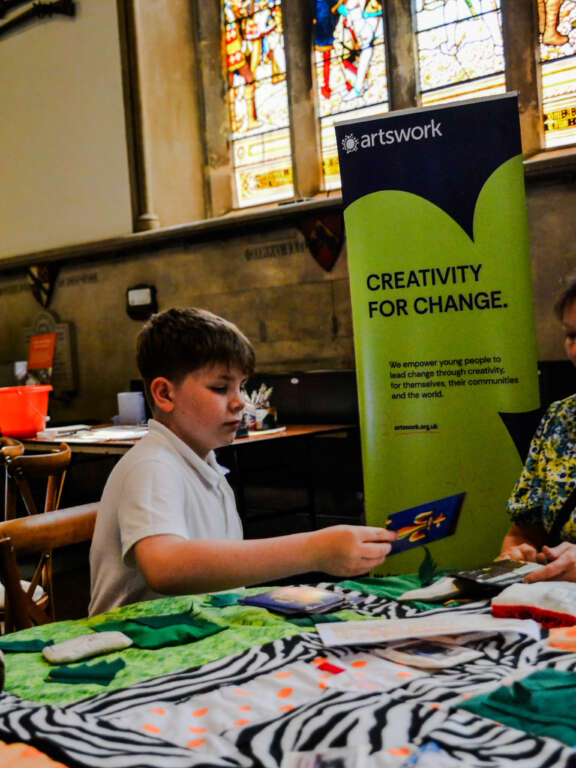 Young person engaging in creative work