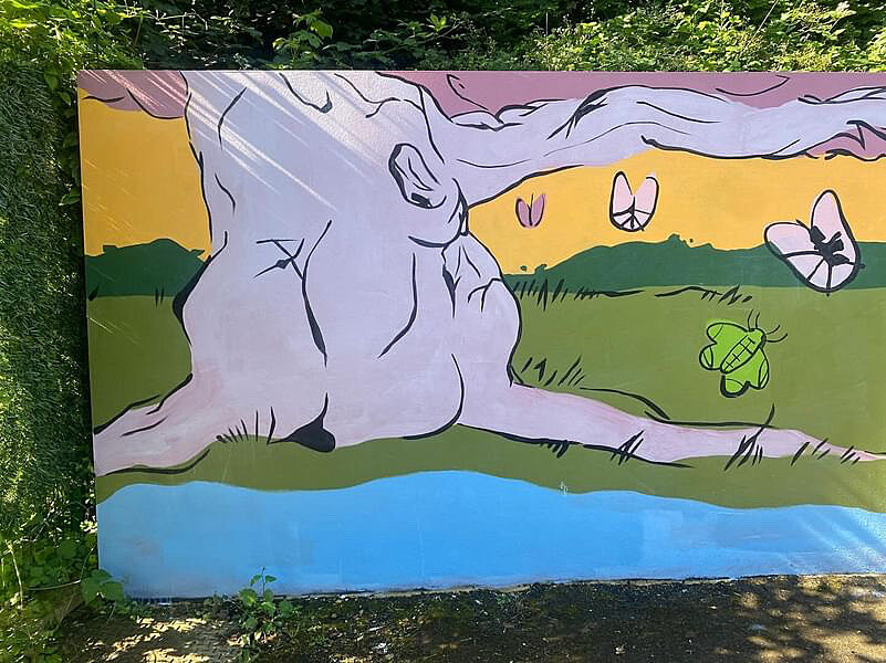 A section of a colourful mural with a large lilac and pink tree, a river, and butterflies