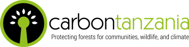 A green black and white icon representing a tree and the text Carbon Tanzania