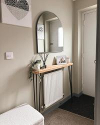 I’ve been so excited for the hallway to be finished so it was more minimal and spacious, since it’s only a small hallway we didn’t want a load of clutter and shoe storage can be a bugger! 

We’ve changed all the white skirting, doors and balusters grey and I found this gorgeous ivory Sherpa storage bench for shoes and I always wanted a hallway mirror (something I regret since I now have to see myself as I leave for the school run!) both from Dunelm. 

What I love the most is the new hallway sideboard made from leftover wood from Liams brothers kitchen countertops and legs from thehairpinlegco (gifted) we still have 2 legs left so our thoughts are a kitchen breakfast bar which will declutter the kitchen a huge amount too! 

#hallwaydecor #hallwayideas #hairpinlegs #entrancedecor #sherpa #wallmirror #decluttering #springintocleaning