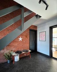 For this Tuesday of Transformation I give you my hallway and stairs, with a grumpy surprise at the end. 
Making the space darker warmed it up, the power of picking the right shades! 
I searched a lot of Ontario to find another barn star as I wanted to bring a piece of Canada home with me but we couldn’t find one and apparently they mean you’re a swinger - didn’t know that information, but I’ll go with it!
PS still want another star lol so the search continues!

#hallway 
#staircases 
#barnstar 
#entrancehall 
#exposedbrick 
#darkaesthetics 
#orangecats