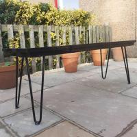 My latest garden project, a table for the new patio. It's made from a recycled black marble hearthplace and four hairpin legs. As solid as a rock and pretty indestructible I would say. thehairpinlegco