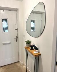 Entrance hallway is starting to take shape 😍

Pebble mirror from therangeuk 

Hairpin oak shelf/ radiator cover from thehairpinlegco 

Roll on January for the LVT flooring to get put down!