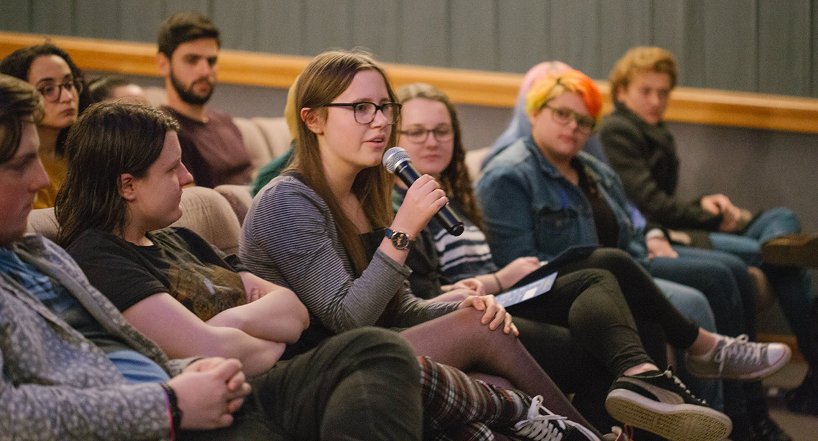 Save the Belmont Cinema Aberdeen community campaign 2023 — young woman with microphone in cinema audience