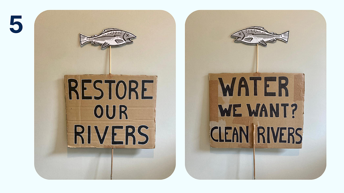 Two protest signs are shown, reading 'restore our rivers' and 'water we want? clean rivers' with a cardboard fish on a stick attached to the top