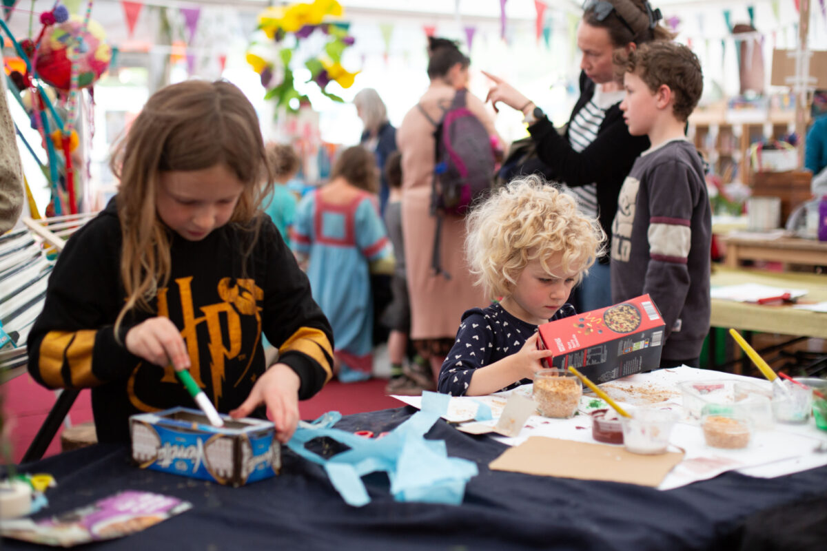 Two children engaging in arts and crafts activity