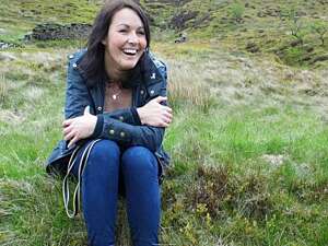 Jayne Mann sat on riverbank