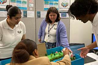 Students demonstrate a marble run
