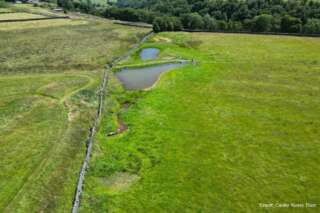 Ariel view of a field with two ponds