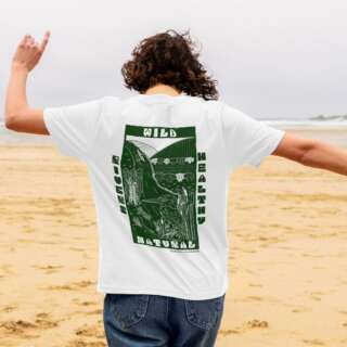 A woman with her back to the camera shows off a white teeshirt with bold green design