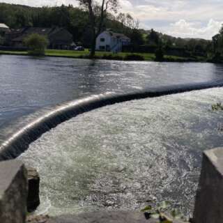 View across a weird in a river