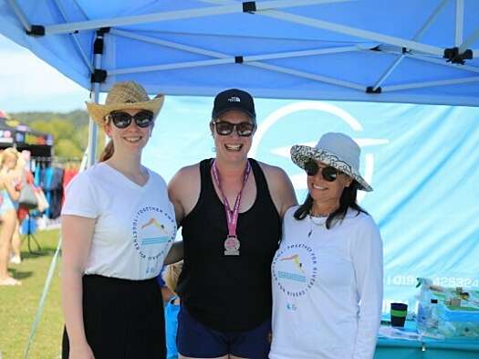 Right to left: PR & Events Coordinator Rebecca Duncan, fundraiser Alice Moon, and Advocacy and Engagement Director Christine Colvin smile