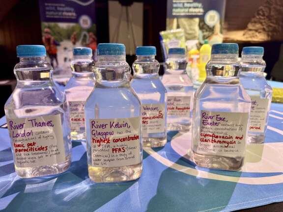 Bottles of river water with labelled chemical concentrations