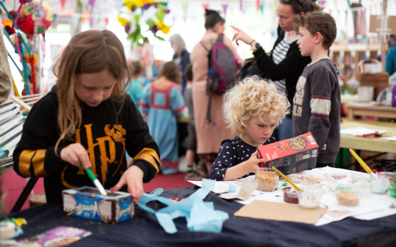 Two children engaging in arts and crafts activity