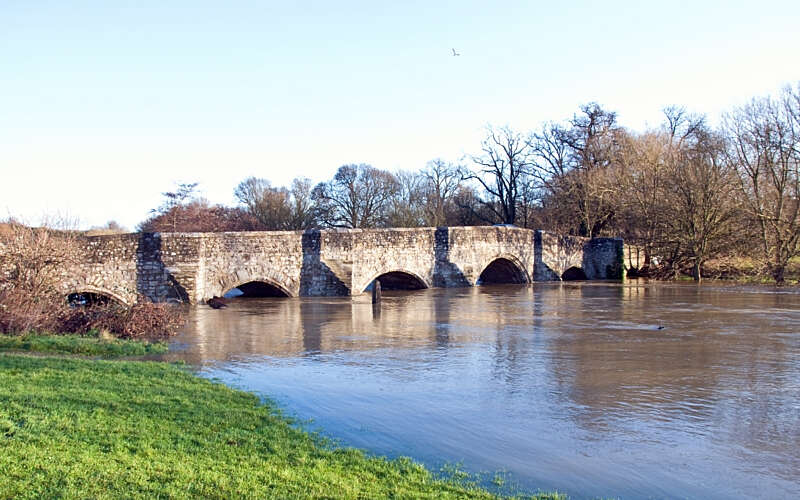 A flooded river and bridge