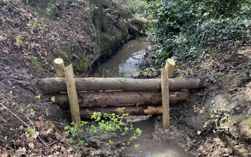 logs placed across a stream to create a leaky dam - credit Mersey Rivers Trust