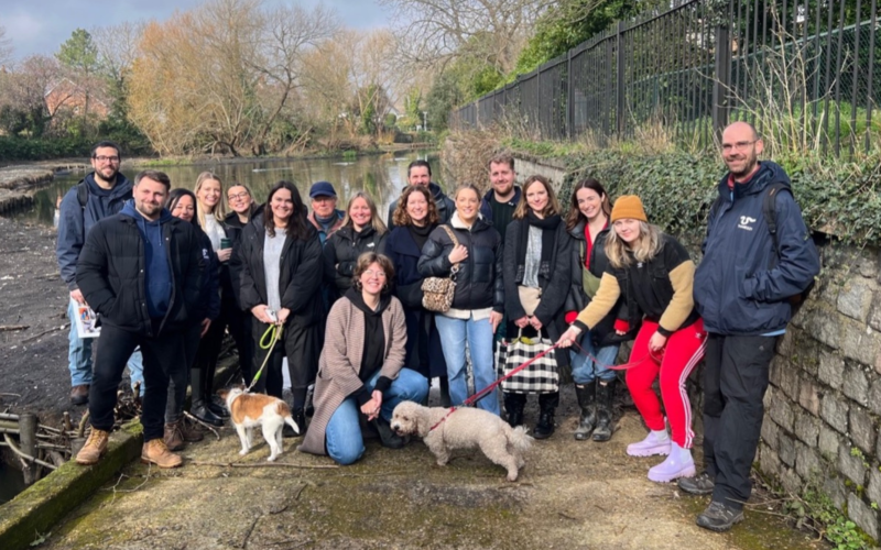 Belu team photo in front of a pond