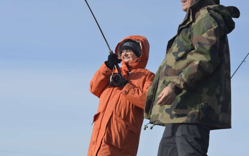 Woman fishing with man