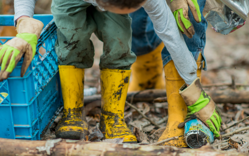 Person in protective clothing picking litter