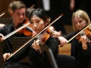 A woman playing violin