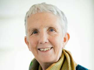 portrait of Ann Cleaves wearing a yellow scarf