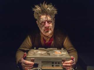 Image of a map holding a tape player