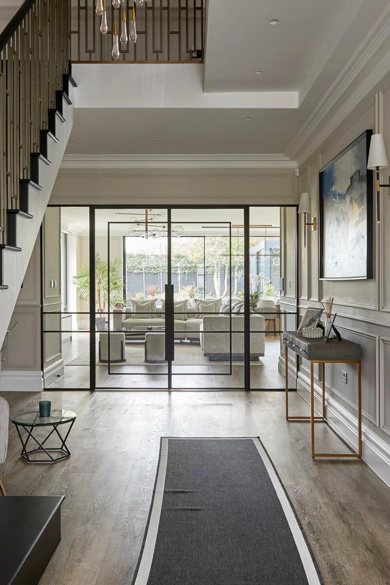 Contemporary hallway and statement staircase