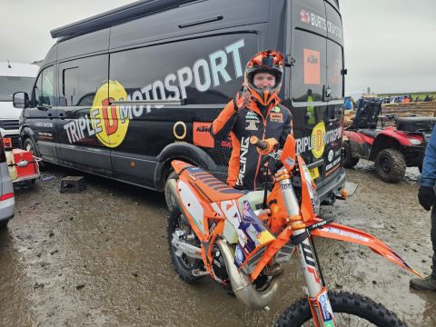 Burts Crayston stands in front of a black Triple D Motosport van showing his thumbs up before the first race at Hapton in Lancashire.