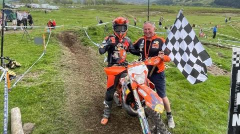 Burts takes the chequered flag with Triple D Motosport gaffer and dad Neil Crayston