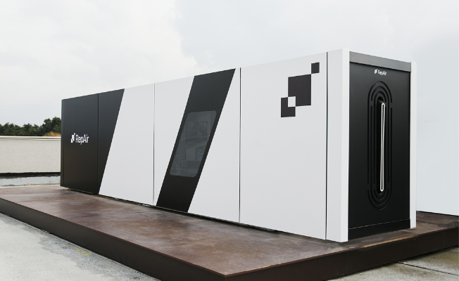 RepAir's DAC field prototype. A black and white box with a logo on the top right corner.