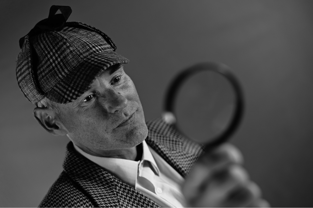 man with a magnifying glass