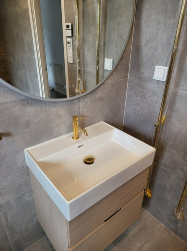 Badrumsrenovering med ljusgrått i Södermalm