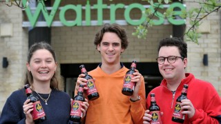 Ag university students raise a glass as their beer hits supermarket shelves