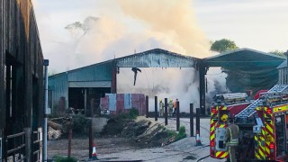 Firefighters tackle blaze affecting 6 barns on Gloucestershire holding