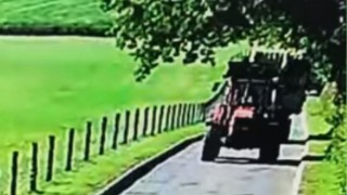 Video: Bale trailer breaks loose from towing tractor