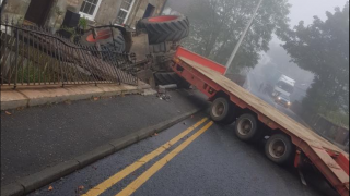 Tractor and low-loader involved in collision with house
