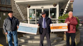 Tractor club delivers Christmas cheer with cheques to charity