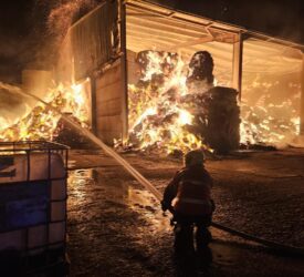 More than 30 firefighters battle blaze involving 300t of straw