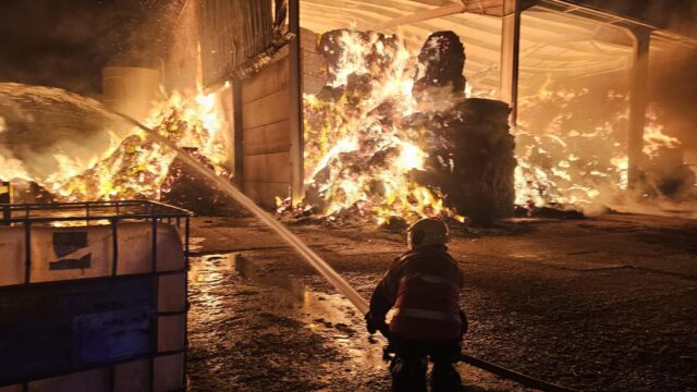 More than 30 firefighters battle blaze involving 300t of straw