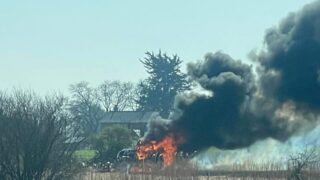 Watch: UK firefighters tackle tractor fire after flames destroy crop fields